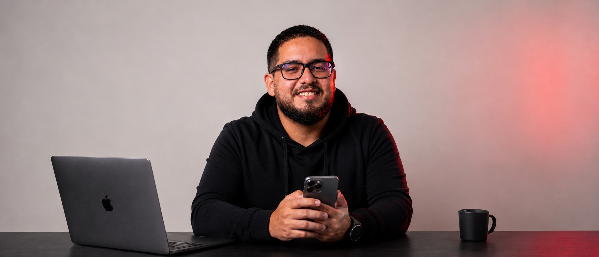 Rodrigo at his desk, phone in hand, ready to talk