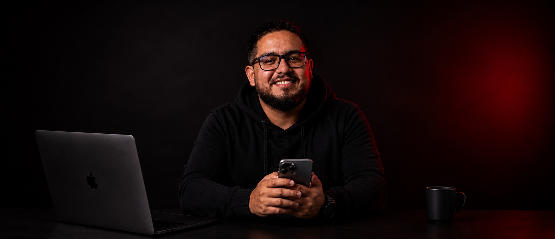 Rodrigo at his desk, phone in hand, ready to talk